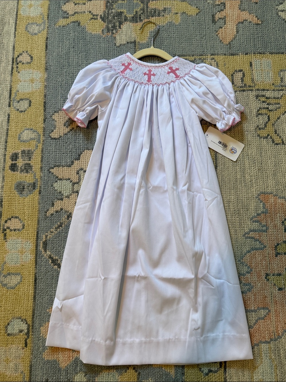 Southern Shine White Smocked Girls' Bishop Dress with Pink Cross Detail